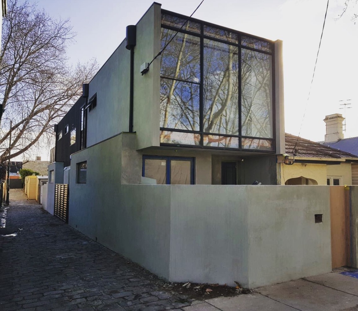 Prahran residence with glazed façade and charcoal cladding