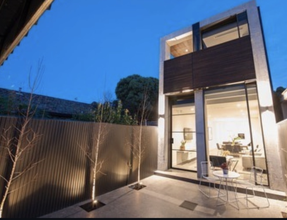 Prahran Victorian home renovation with copper-toned cladding and concrete
